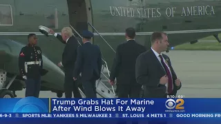 President Trump Grabs Marine's Hat After Wind Blows It away