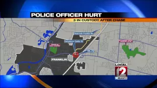 Police officer hurt and three in custody after chase