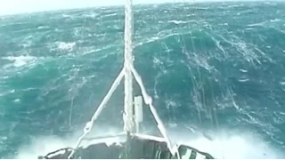 A tug boat in a 12 strength ! rogue wave