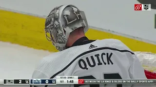 Jonathan Quick explodes across the crease to makes a glove save on Evander Kane.