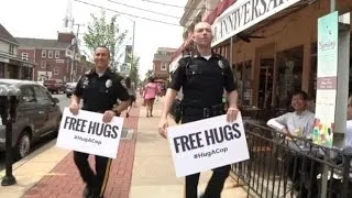 What Happens When Two Police Officers Offer Free Hugs