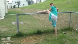 Drunken Wife Attempting to Hop a Fence