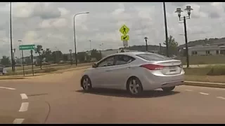 Hyundai Elantra driver cuts into the roundabout without even looking.
