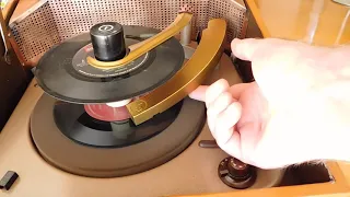 Columbia portable 3 speed automatic record player playing a couple 45's.