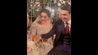 Minal khan and Ahsan Mohsin Akram cutting cake on her Walima 🎂