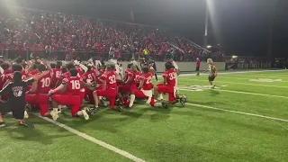 High School Football Team Performs Ceremonial Dance