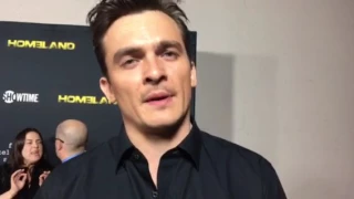 Rupert Friend chats "Homeland" on red carpet at Emmy FYC event