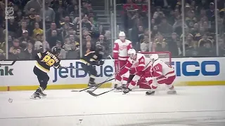 Moritz Seider hit in face with puck during Red Wings vs. Bruins matchup.