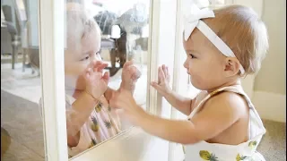 TWIN BABY GIRLS LAUGHING THROUGH THE GLASS (CUTE!)