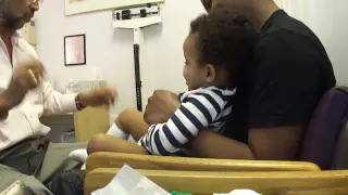 Baby laughing while getting shots