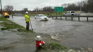 The D.O.T. Borrows My Rake To Drain Major Street Flood