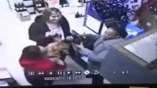 Angry woman smashes up liquor at store.