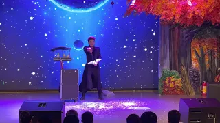 Handsome Chinese Magician Performs Magic Dove Show