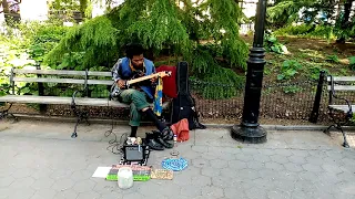 Adjua playing the Blues as Sweet as I've Ever heard in Washington Square Park NYC