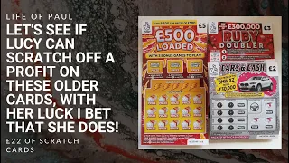 £22 of lottery scratch cards, a mix of £2, £3 and £5 scratch tickets scratched off by Lucy