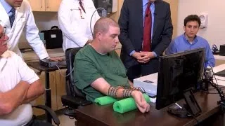 Paralyzed man moves hand with brainwave breakthrough