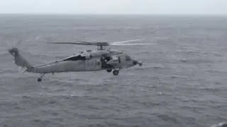 A Blackhawk lands on the USS America