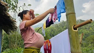 27 year old pregnant single mother washing newborn clothes, gardening.