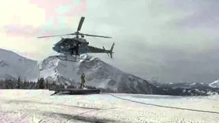 Helicopter winching on the snow-mobile