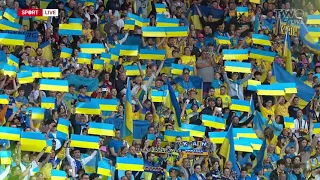 The Ukrainian players and fans sing their national anthem at Hampden Park. 🇺🇦