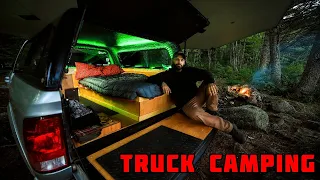 Truck Camping In Rain With Campfire And Tarp Shelter