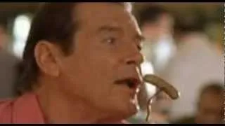 Roger Moore "fellating" a sausage