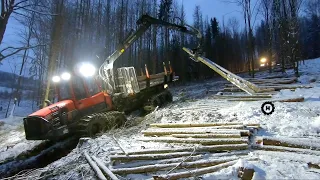 Snow, tracks and Komatsu machines in slope