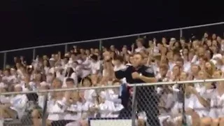 Cop enters school's football stands and shocks everyone