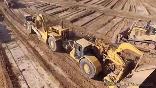 Birds eye view of an army of CAT 657E and 657G scrapers in action