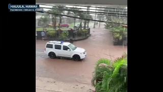 Torrents of water gush past man's home in Hawaii floods