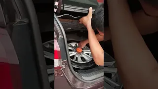 Installing spare tire in the trunk