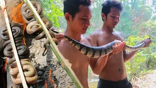 Primitive Technology: Catch snake by bamboo trap - Cooking snake eating show by Survival time
