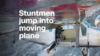 Red Bull stuntmen fly into a plane mid-air