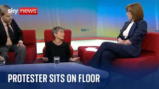 Just Stop Oil protester sits on floor during interview with Kay Burley