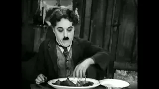 Charlie Chaplin eating his shoe