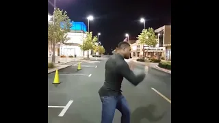 Francis Ngannou shadow boxing in the middle of a road