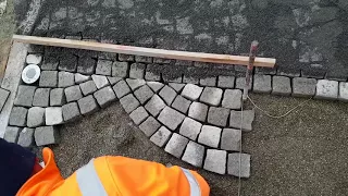 Arch paving with hammer granite stones forecourt