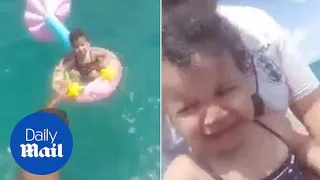 Shocking moment baby rescued after floating nearly a mile out to sea in rubber ring in Tunisia