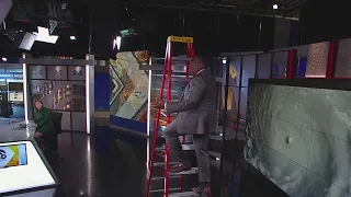 A.J. Hilton uses ladder to demonstrate storm surge from Hurricane Ian