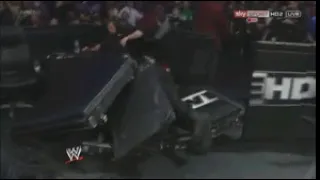 Roman Reigns Spears Kane through barricade