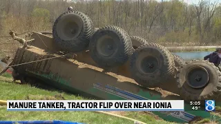 Manure tanker, tractor flip over near Ionia