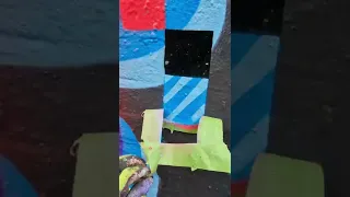 Painting Glowing Street Art On Famous Graffiti Wall In London. Fat Cap Sprays