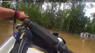 Bodycam footage captures Houston police officer rescuing man, dogs from flood