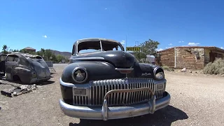 Deserted old rusty 1950 DeSoto Car by Abandoned Desert Inn Motel