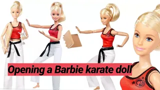 Opening a Barbie karate doll