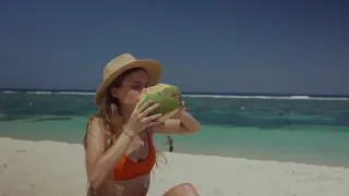 Mikhail Nilov, a bikini and a coconut