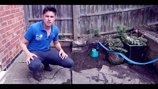 How to Drain a Flooded Patio Using a Water Pump