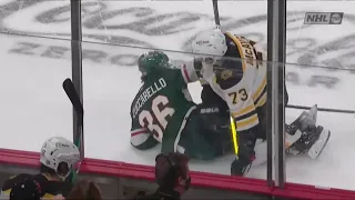 Charlie McAvoy throws a hit on Mats Zuccarello