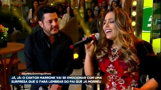 Fernanda, que foi ajudada por Bruno e Marrone, canta ao lado da dupla no palco do Domingo Show