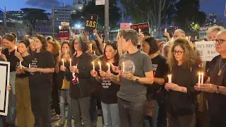 Sirens sound and relatives of hostages light candles in Tel Aviv as Israel marks Memorial Day